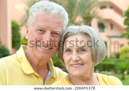 happy loving elder couple at tropic resort