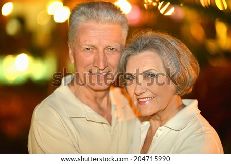 Cute senior couple on night street closeup