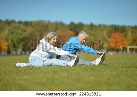 Happy active fit senior couple exercising outdoors