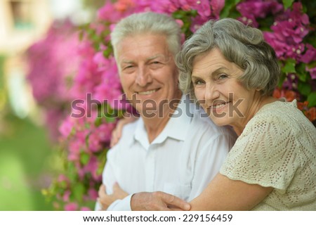 Loving happy elder couple in tropic resort