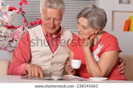 Cute old couple at breakfast at table