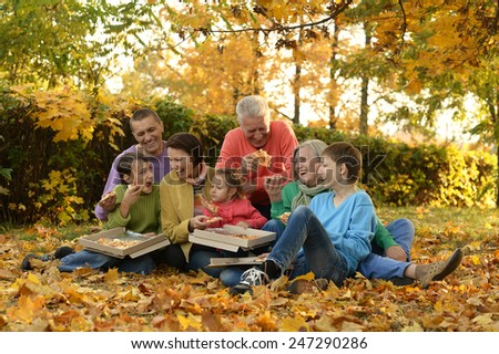 large family picnic in the woods