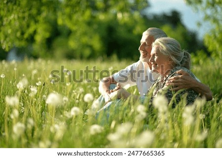 Similar – Image, Stock Photo Elderly couple embracing in autumn park