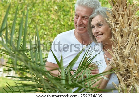 Portrait of a senior couple at tropic hotel garden
