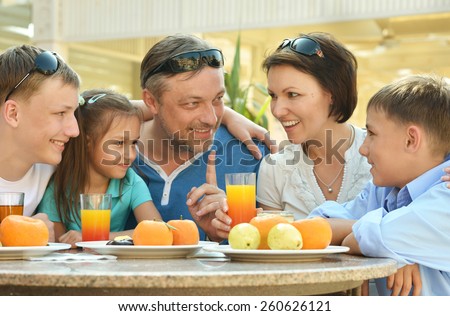 Happy family at breakfast on the table