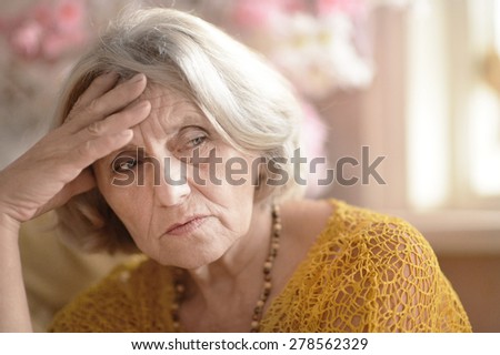 Portrait of sad elderly woman close up