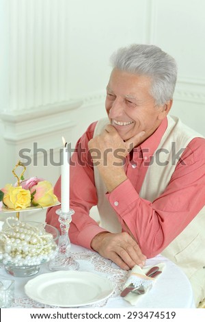 Happy elderly man on dating  at restaurant