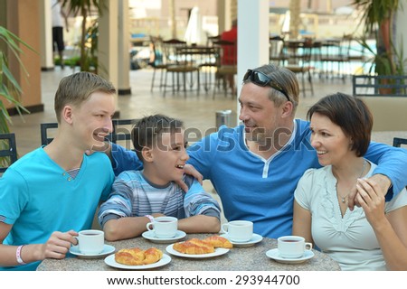 Happy family at breakfast on the table
