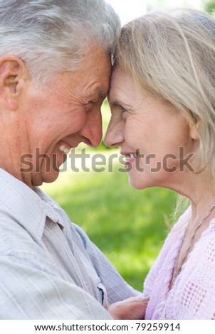 portrait of a happy elderly couple at nature