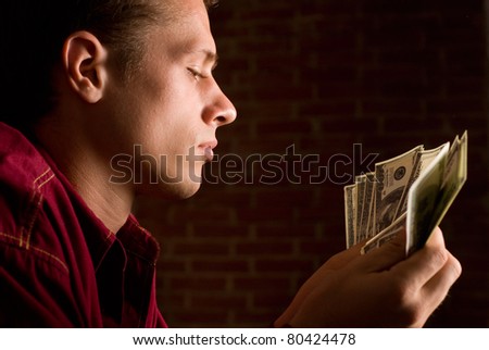 portrait of a man with money in a shirt