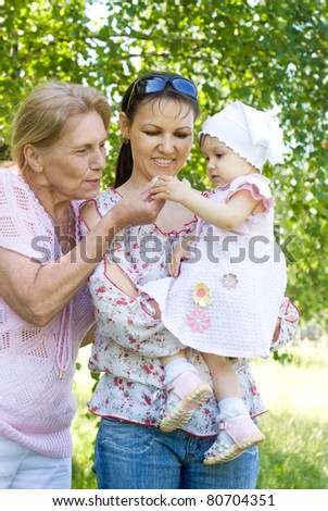 mom and grandmother with baby at nature