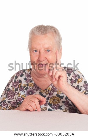 cute granny posing at table on a white
