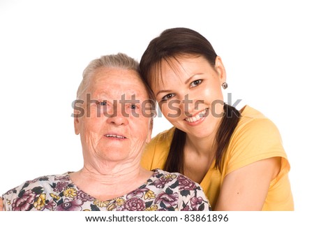 old mom with her adult daughter on white