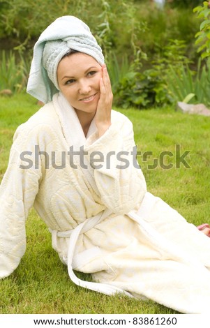 cute young woman in gown at nature