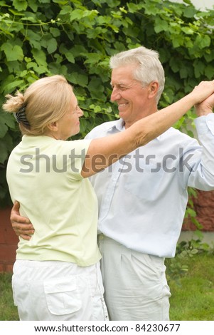 portrait of a nice elderly couple dancing