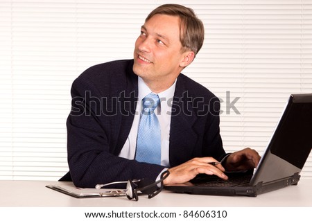 portrait of a nice man with computer