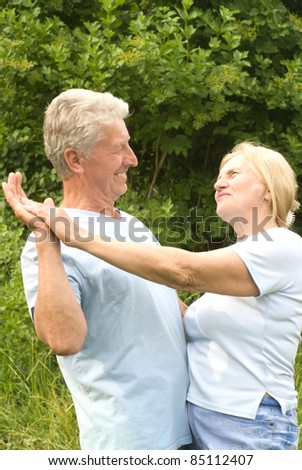 portrait of a cute old couple dancing
