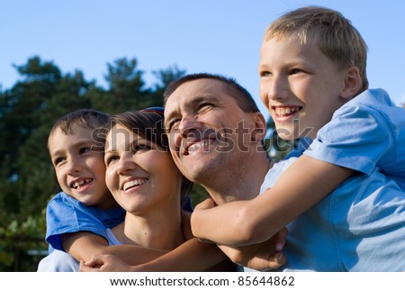 portrait of a nice family at nature