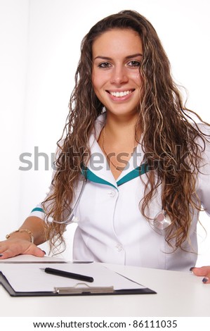 portrait of a cute nurse posing on white
