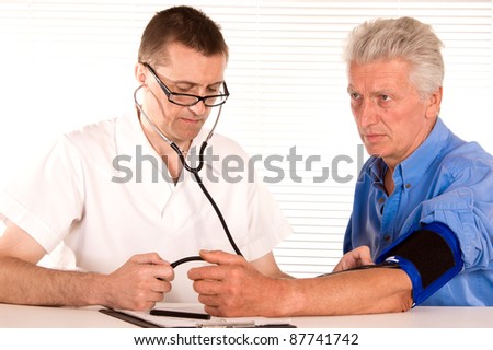 portrait of a cute doctor with aged patient