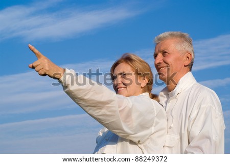 portrait of a happy old couple at sky