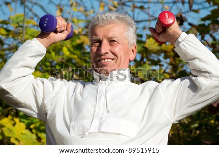 portrait of an active old man at park