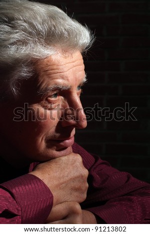 portrait of an old man in darkness