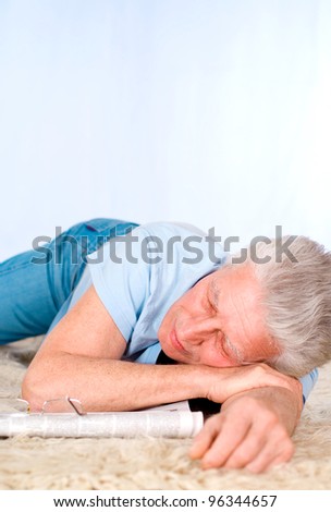 portrait of a tired old man on carpet