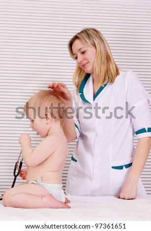 portrait of a nice doctor with baby