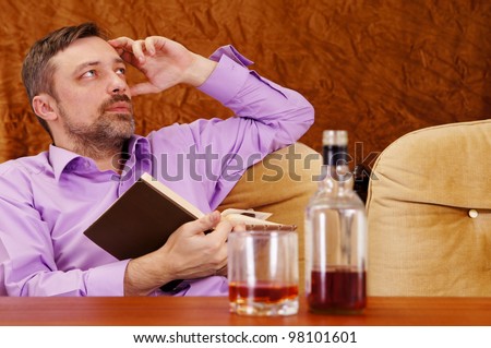 nice guy drinking whiskey at the table