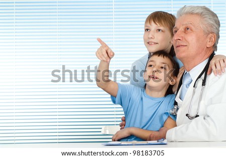Happy joy Caucasian doctor with patients on a light background