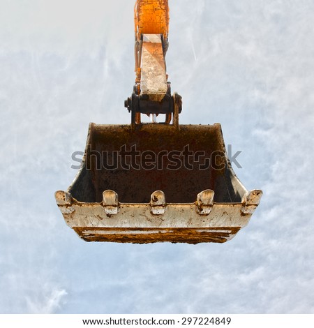 Excavator bucket on blue sky, Industrial excavator machine
