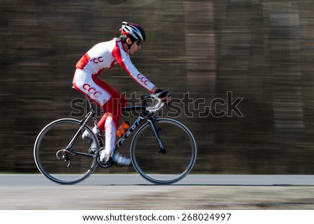LUBIN,  POLAND - APRIL 09, 2015: Cyclist from a cyclist group CCC SPRANDI POLKOWICE during training. CCC SPRANDI POLKOWICE is the best cycling group in Poland and in 7th place in the world ranking.