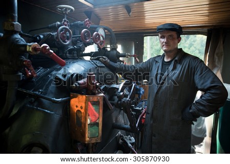 Portrait machinist assistant of a steam locomotive