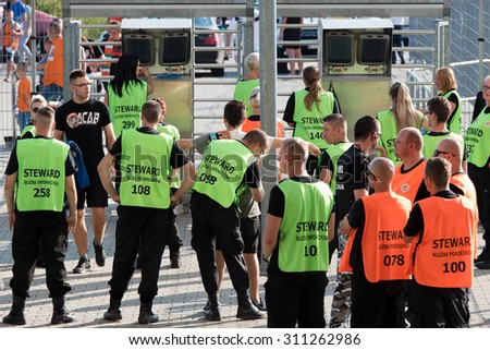 LUBIN, POLAND - AUGUST 29, 2015:  Security searches supporters at the entrance to the stadium before match Polish Premer League between KGHM Zaglebie Lubin - Ruch Chorzow (3:1).