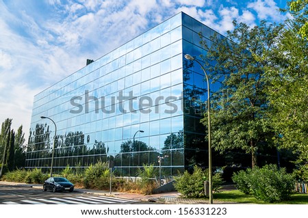 MADRID - SEPTEMBER 08: glass office building in Barajas, next to Juan Carlos I Garden, on September 08, 2013 in Madrid, Spain.