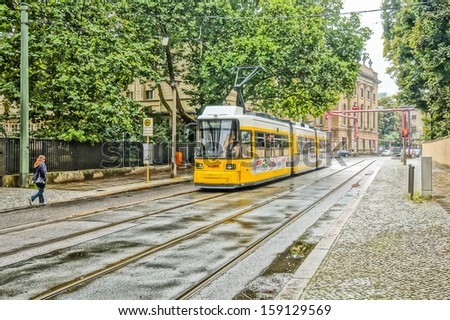 BERLIN, GERMANY - SEPTEMBER 20: typical yellow tram on September 20, 2013 in Berlin, Germany. The tram in Berlin is one of the oldest tram systems in the world.