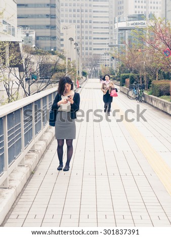 TOKYO, JAPAN - MARCH 31: Skyscraper district on March 31, 2015 in Tokyo, Japan. It is one of the 47 prefectures of Japan. The Greater Tokyo Area is the most populous metropolitan area in the world.