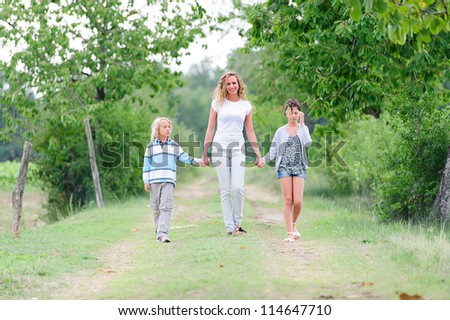Beautiful Young Woman with Two Children Outside,Italy
