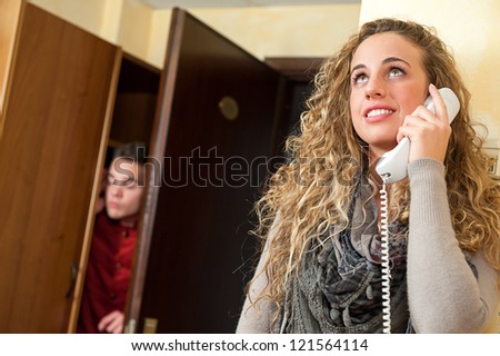 Porter listen at the door a fascinating girl at the phone