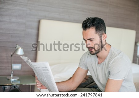 Man Reading Newspaper on Vacation