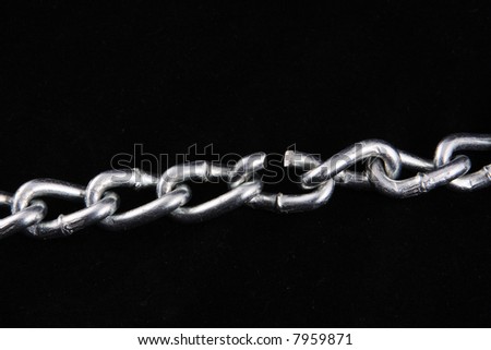 Chain with broken link on a black background