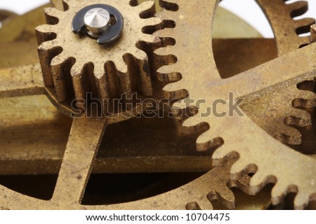 Gears from an antique clock in a close-up view.