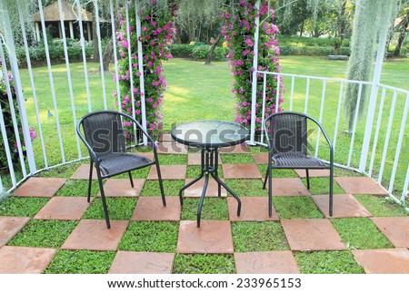 Wicker chair in the garden decorated with tiled floor