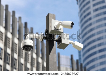 Similar – Image, Stock Photo Pole with city cameras against blue sky