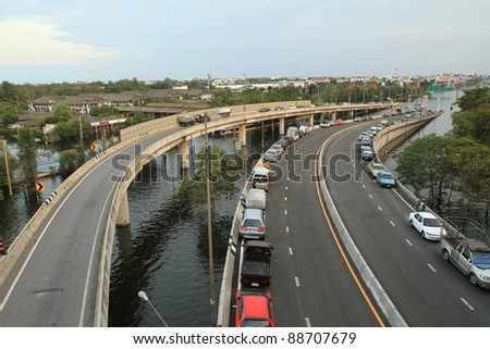 BANGKOK-NOV 13 : Cars park on bridges during the worst flooding in decades on November 13,2011 Bangkok, Thailand.