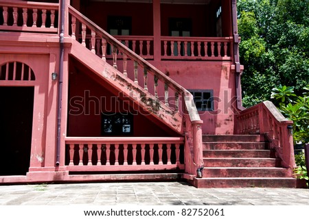 red stairs in house and nice blue sky