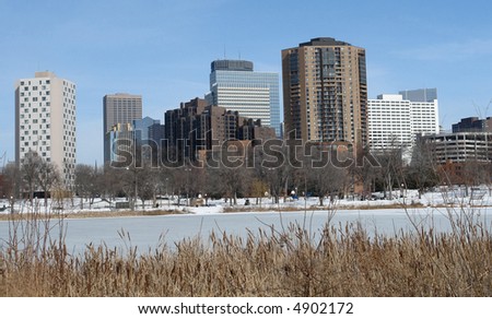 Minneapolis skyline across from frozen pond in winter