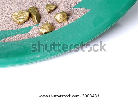 Gold Nuggets Seperated from the Sand in a Gold Pan
