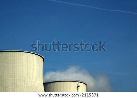 Image of big energy power towers, producing white smoke. Concept: how energy is born. Closeup of power plant